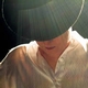 woman in a brimmed hat