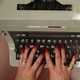 hands on typewriter