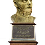 golden statue of a mans head
