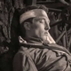 wounded soldier against a tree